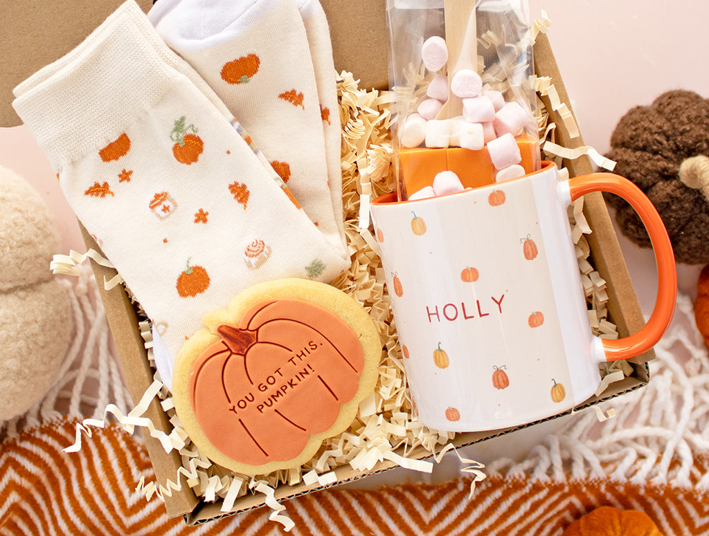 TREATBOX PRESENTS A GIFT BOX FEATURING PUMPKIN THEMED MUG, PUMPKIN HOT CHOCOLATE, PUMPKIN ICED BISCUIT AND PUMPKIN SOCKS