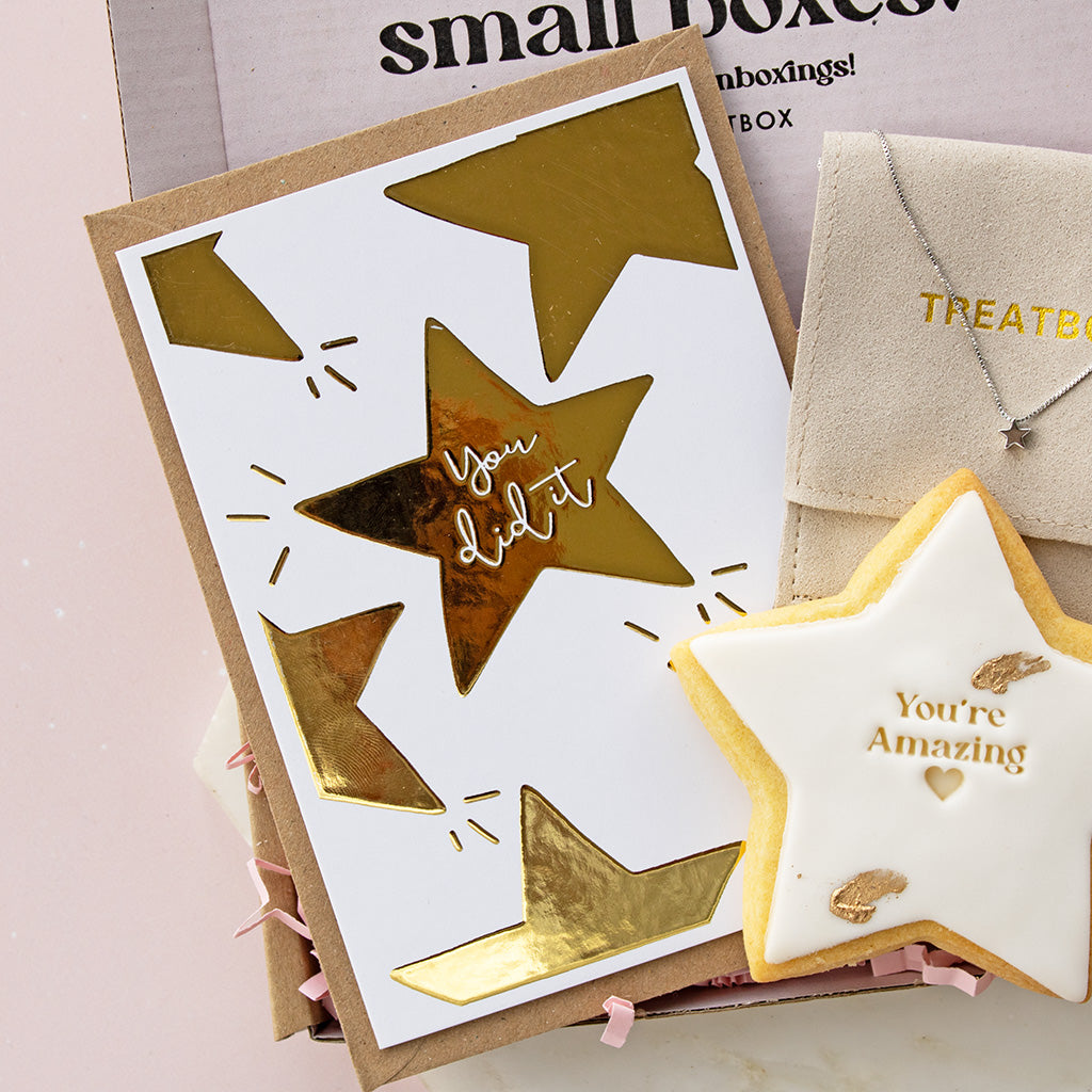 Star foil card with gold text and matching star-shaped cookie 